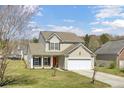 Well maintained two-story home with a two car garage, a manicured lawn, and a welcoming entrance at 629 English Oak Cir, Moncks Corner, SC 29461