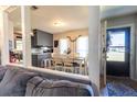 Open-concept dining area with adjacent kitchen, natural light, and stylish decor at 105 Wade Ct, Summerville, SC 29486
