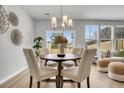 Dining area features a table with four chairs, an attractive pendant light and a large window at 108 Brown Swiss Cir, Summerville, SC 29483