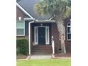 Close up of the front door and entryway with a stone statue at 112 Amanda Cir, Goose Creek, SC 29445