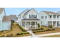 Stunning home boasting great curb appeal, complemented by lush greenery and a well-maintained front yard at 115 Winding Branch Dr, Summerville, SC 29486
