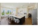 Bright kitchen featuring a large center island with seating and modern appliances at 1251 Weather Helm Dr, Mount Pleasant, SC 29466