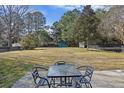 Large, expansive backyard featuring mature trees and a storage shed, perfect for outdoor activities and relaxation at 1264 Fort Dr, Hanahan, SC 29410