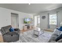 Comfortable living room with hardwood floors, a cozy recliner, and plenty of natural light at 131 Brant Dr, Summerville, SC 29483