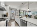 Modern kitchen featuring a large island, stainless steel appliances, and ample counter space at 134 Country Oaks Ln, Wando, SC 29492