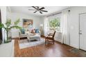 Inviting living room with neutral tones, a ceiling fan, and a view of the outdoors at 1423 Bexley St, North Charleston, SC 29405