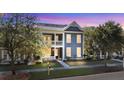 Charming two-story home with a welcoming front porch and beautifully landscaped front yard at 155 Village Ponds Dr, Summerville, SC 29483