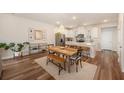 Open-concept dining area features stylish decor and seamlessly connects to the kitchen at 162 Winding River Dr, Johns Island, SC 29455