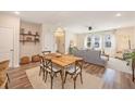 Open-concept dining area features stylish decor and seamlessly connects to the living area at 162 Winding River Dr, Johns Island, SC 29455