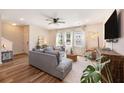 Bright living room with modern decor, hardwood floors, a ceiling fan, and lots of natural light at 162 Winding River Dr, Johns Island, SC 29455