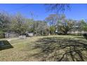 Spacious backyard with mature trees and plenty of shade at 1634 Sumner Ave, North Charleston, SC 29406