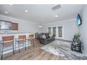 Open-concept living room featuring hardwood floors, a comfortable sofa, and lots of natural light at 164 Buchanan Cir, Goose Creek, SC 29445