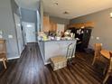 Functional kitchen featuring wood cabinets, laminate flooring, and spacious gray countertop at 223 Westbrooke Rd, Summerville, SC 29486