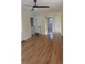 Open living area featuring refinished hardwood floors and neutral paint scheme at 2231 Burris Rd, Charleston, SC 29414