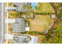 Aerial view showcasing a home on a large lot with a pool and fire pit at 2335 Brinkley Rd, Johns Island, SC 29455