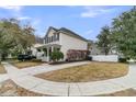 Beautiful home with a covered front porch, black shutters, and landscaped front yard with a paved driveway at 2369 Chadbury Ln, Mount Pleasant, SC 29466