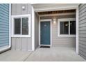 Charming entrance featuring a teal front door with sidelight windows and a covered porch at 268 Alexandra Dr # 9, Mount Pleasant, SC 29464