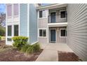 Exterior view of home featuring private balcony, neutral siding, and a well-maintained walkway at 268 Alexandra Dr # 9, Mount Pleasant, SC 29464