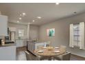Bright eat-in kitchen features stainless steel appliances and granite countertops at 312 Pine Crest View Dr, Summerville, SC 29486