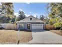 Well-maintained single-Gathering home with a two-car garage and a mailbox at 409 Klein St, Walterboro, SC 29488