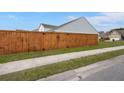 Privacy fence encloses the backyard at 420 Thoroughbred Dr, Moncks Corner, SC 29461