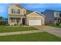Attractive two-story home with a manicured lawn and an attached two-car garage at 607 Silver Spruce St, Summerville, SC 29486