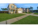 Beautifully landscaped front yard and exterior of a two-story home with a sidewalk at 607 Silver Spruce St, Summerville, SC 29486