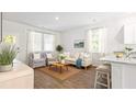 Open-concept living space with ample seating, natural light, and a seamless flow at 6257 Gritman Dr, Hollywood, SC 29470