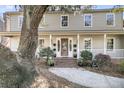 Charming two-story home with a welcoming front porch, mature landscaping, and classic architectural details at 741 Creekside Dr, Mount Pleasant, SC 29464