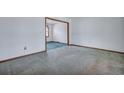 Empty living room with neutral walls and carpets, offering a blank canvas for new homeowners at 7659 Allwood Ave, North Charleston, SC 29418