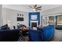 Bright living room featuring hardwood floors, fireplace, and stylish decor at 8506 Kennestone Ln, North Charleston, SC 29420
