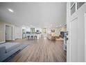 Open concept living space with hardwood floors and a view of the kitchen at 914 King Richard Dr, Charleston, SC 29407