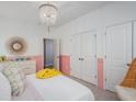 Comfortable bedroom features closet space and unique decorations, including a chandelier at 1058 Tea Time Dr, Summerville, SC 29485
