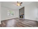 Bright living room with modern fireplace, recessed lighting and sleek, wood-look floors at 1146 Rivercrest Dr, Charleston, SC 29412