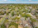 A sprawling aerial view shows the home's neighborhood and the city skyline off in the distance at 1515 Devons St, Charleston, SC 29412