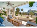 Inviting covered porch with comfortable seating and a view of the street and neighborhood at 184 Tradd St, Charleston, SC 29401