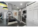Modern kitchen features granite countertops, stainless steel appliances, and convenient access to the laundry area at 2011 N Highway 17 # 1400 J, Mount Pleasant, SC 29466