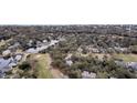 Expansive aerial view of a golf course community with homes nestled among mature trees at 263 Sea Cloud Cir, Edisto Island, SC 29438