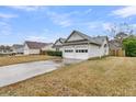 Well-maintained single-story home with a spacious two-car garage and a neat lawn, offering curb appeal at 346 Courtney Round, Summerville, SC 29483