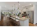 Spacious kitchen with a large island, pendant lighting, stainless steel appliances, and ample counter space at 422 Switchgrass Dr, Summerville, SC 29486