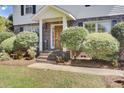 Classic front entrance with brick steps, dark railings and a warm wooden door at 649 Pawley Rd, Mount Pleasant, SC 29464