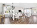 Bright, open-concept living and dining area with hardwood floors and modern decor at 790 Clay Field Trl, Summerville, SC 29485