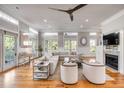 Bright and spacious living room featuring hardwood floors, fireplace, and a comfortable seating area with natural light at 108 Carolina Blvd, Isle of Palms, SC 29451