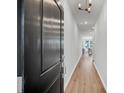 Inviting entry hallway with wood floors leading to the living area with natural light at 110 Brown Swiss Cir, Summerville, SC 29483