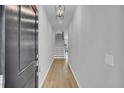 Inviting entryway with hardwood floors and stairs leading to the upper level at 112 Brown Swiss Cir, Summerville, SC 29483