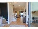 Inviting foyer with hardwood floors, elegant staircase, and a view into the beautifully decorated living spaces at 112 Carpenter St, Summerville, SC 29486
