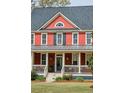 Attractive two-story home with a welcoming front porch and well-manicured lawn at 1149 Lands End Dr, Hanahan, SC 29410