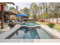 Backyard pool and lounge area, perfect for outdoor entertaining and relaxation at 1149 Lands End Dr, Hanahan, SC 29410