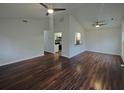 Open floor plan living room with hardwood floors, high ceilings, and breakfast bar at 117 Coronet St, Summerville, SC 29483