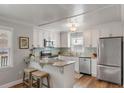 Well-lit kitchen with stainless appliances, granite countertops, and white cabinets at 1200 Island View Dr, Mount Pleasant, SC 29464
